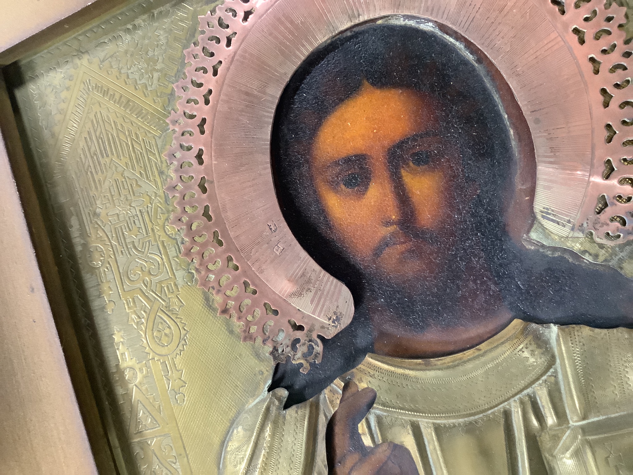 A 19th century Russian icon of Christ Pantocractor, with brass and copper oklad, 26 x 21cm, glazed case